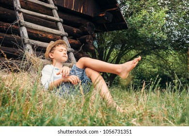 Little Lazy Boy Sleeps Under Old Hayloft In Garden