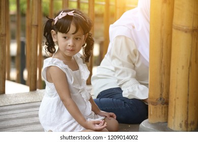 Little Malay Girl Eating Nasi Lemak Outdoor