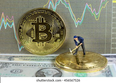 A little miner is digging on golden bitcoin with dollar and graph background. conceptual image of bitcoin mining and trading.