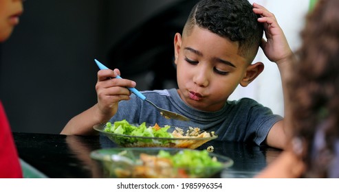 Little Mixed Race Child Eating Food. Hispanic Kids Lunch Time