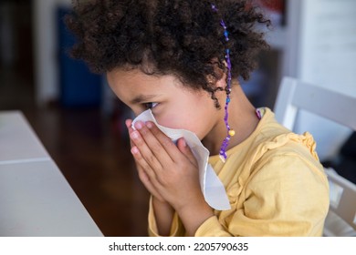 Little Mixed Race Girl Cleaning Her Nose With A Tissue After Sneezing. Copy Space.