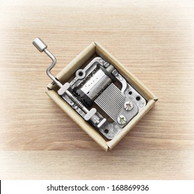 Little music box on a wooden background. - Shutterstock ID 168869936
