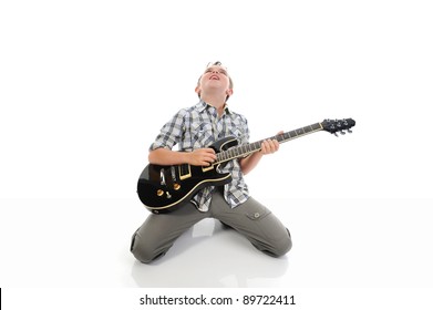 Little musician playing guitar. Isolated on a white background
