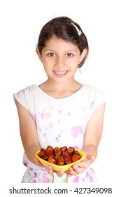 Little Muslim Kid Presenting A Dish Of Dates For Iftar - Breaking Fast In Holy Ramadan - Showing Generosity Of Ramadan