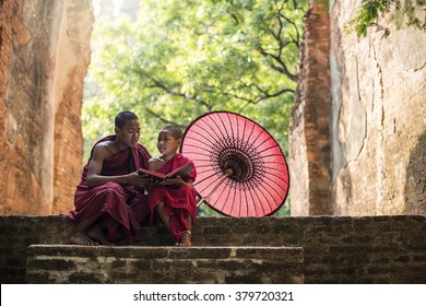 Little Myanmar Monk Reading Book, Sitting Outside Monastery, Bagan, Myanmar