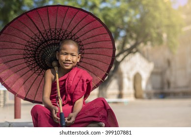 Little Myanmar Monk Sitting Outside Monastery, Bagan, Myanmar