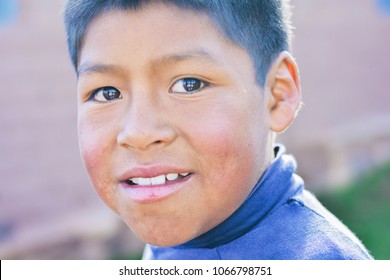 Little Native American Boy Smiling Happily Outdoors.