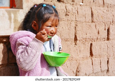 Little native american girl eating. - Shutterstock ID 2017829249