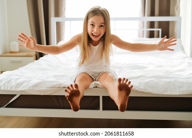 Little Naughty Cheerful Girl Schoolgirl Dirty Feet At Home On A White Background Bedroom Grimaces Smiles All Over And Faces