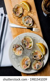 Little Neck Clams. Fresh clams served with garlic, shallots, cocktail sauce, mignonette sauce and fresh lemons and limes. Classic American steakhouse or French bistro appetizer.