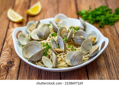 Little Neck Clams with pasta on a white plate. Pasta with clams. 
