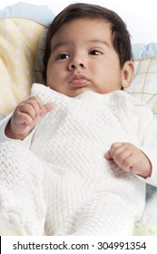 A Little Newborn Latino Baby In Various Poses.