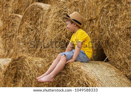 Similar – Vater und Sohn sitzen im Park.