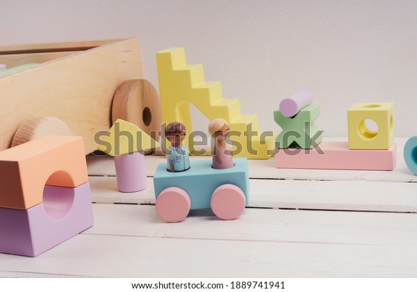 little\
people made of wood. The car is blue with pink wheels. Children\'s\
toys made of natural material. Wooden construction kit in a large\
box-cars made of plywood. Ecological\
material.