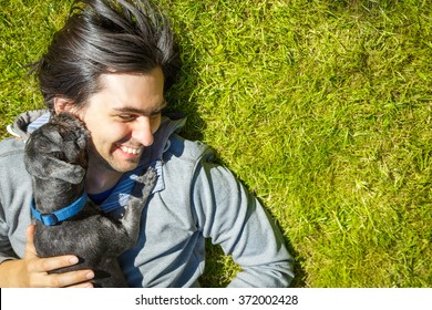 Little Pet Dog and His Owner Having Fun Outdoors