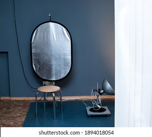 Little Photo Studio With Lamp And Reflector Blue Wall Background Retro