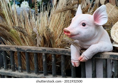 Little Pink Ceramic Pig Figurine For Sale In Interior Shop. Kitsch Style Ignores The Usual Principles Of Interior Decor.  