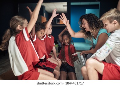 Little Players And Female Coach At The Locker Room Excited And Ready For The Match. Children Team Sport