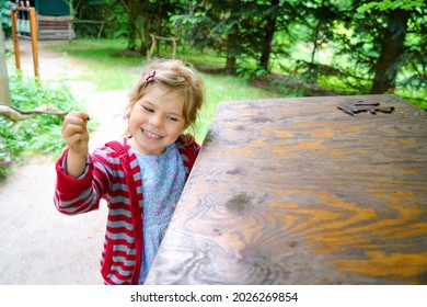 Little Preschool Girl Exploring Life Of Squirrels In Forest. Active Happy Child Learning About Food Of Animals. Children And Environment, Forest Life And Wild Nature.