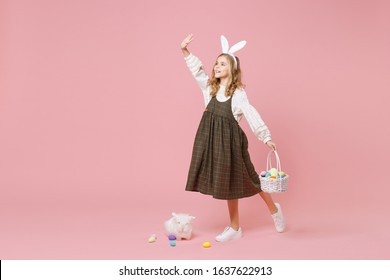 Little Pretty Blonde Kid Girl 11-12 Years Old In Spring Dress Hold Fluffy White Bunny Rabbit Isolated On Pastel Pink Background Children Studio Portrait. Childhood Lifestyle Happy Easter Concept