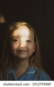 Little Pretty Girl Smiling With Sunny Bunny On Face. Cute Child With Blue Eyes Laughing. Long Blond Hair. Vintage Lens Kids Home Portrait In Daylight. Growing Up Psychology Personal Development.