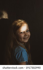 Little Pretty Girl Smiling With Sunny Bunny On Face. Cute Child With Blue Eyes Laughing. Long Blond Hair. Vintage Lens Kids Home Portrait In Daylight. Growing Up Psychology Personal Development.