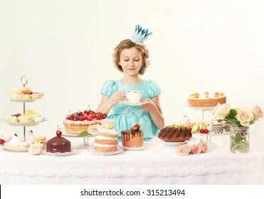 Little Princess In Elegant Blue Dress, Drinking Tea. Birthday Party. Indoor