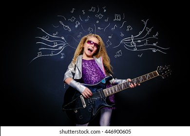 Little Rock Star Singing With Her Electric Guitar Over Musical Background. Music Concept.