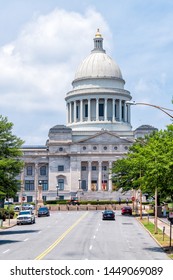 Little Rock, USA - June 4, 2019: State Capitol of Arkansas vertical view on sunny day with street road and cars parked in summer