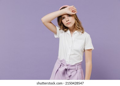 Little Sad Tired Sick Exhausted Blonde Kid Girl 12-13 Years Old In White Shirt Put Hand On Forehead Have Headache Isolated On Purple Background Children Studio Portrait. Childhood Lifestyle Concept