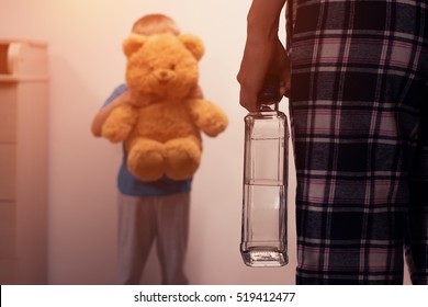 Little Scared Son Covering His Face With Toy Bear From Angry Drunk Mother. Child Abuse. Alcoholic Addiction. Domestic Violence.