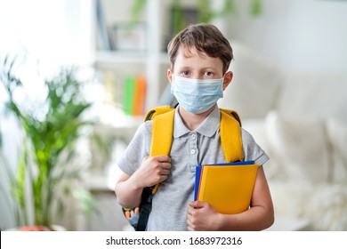 Little Schoolboy Wearing Mask During Corona Virus And Flu Outbreak. Llness Protection For Kids. Mask For Coronavirus Prevention. School Kid Coughing. Little Boy Breathes Through Mask, Going To School.