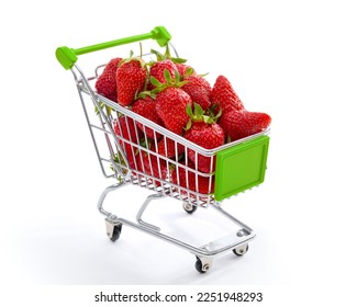 Little shopping cart filled with raw delicious strawberries. Concept shot symbolizing buying healthy food or ordering online - Shutterstock ID 2251948293