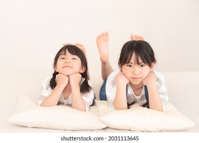 Little Sisters In Matching Clothes