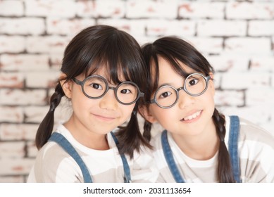 Little Sisters In Matching Clothes