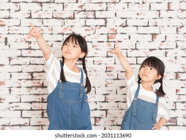 Little Sisters In Matching Clothes