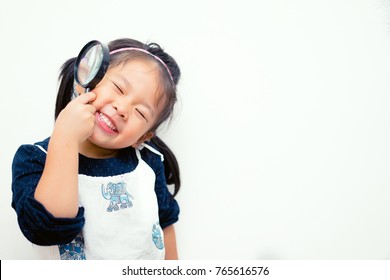 Little Smart Girl Child Holding Magnifying Glass On Brain.Brain Scan And Brain Activity For Kid,Education Concept.