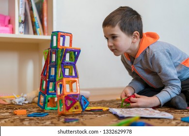 Little Smiling Boy Playing With Magnetic Constructor Toy. Boy Playing Intellectual Toys