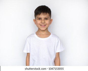 Little Smiling Boy In White T-shirt Isolated On White