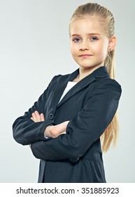 Little smiling business woman studio portrait. Child girl dressed black business suit . Smiling girl.