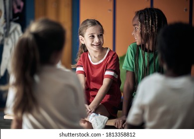 The little soccer teammates waiting for a training in a locker room  - Powered by Shutterstock