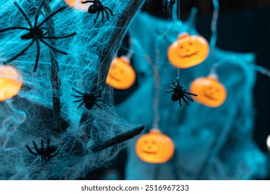 A little spider caught in a spider web. Halloween. Brightly colored pumpkins. Spider web and spiders. Background - Powered by Shutterstock - Get 15% off with code: PIKWIZARD15
