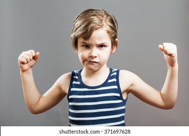 Little Sportive Tough Boy In Striped  Muscle Shirt, Showing His Muscles