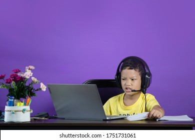 The Little Student Feeling Frustate When He Can't Follow His Teacher Because Of WIFI Disconnect. He Feeling Stress And Upset. Online Class, New Normal COVID-19 Concep
