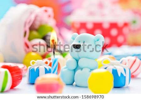 little sugar teddy with a candle and candies