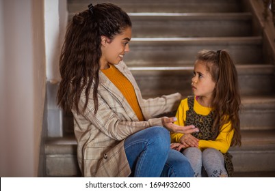 Little Talk. African American Mother With Her Daughter.