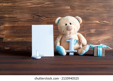 Little Teddy Bear Toy With Gift Box, Digit One On Table With Copy Space. Baby Shower, Accessories, Stuff, Present For Boy Child First Year Happy Birthday, Newborn Party Background, Mock Up, Template.