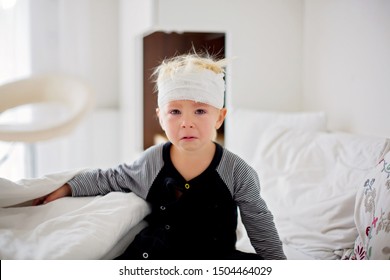 Little Toddler Boy With Head Injury, Lying In Bed, Tired, Sleeping