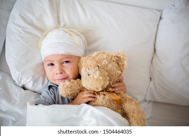 Little Toddler Boy With Head Injury, Lying In Bed, Tired, Sleeping