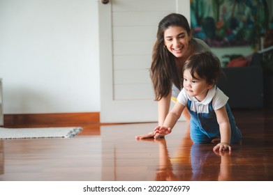 Little Toddler Children With First Walk Step With Stairs At Home, Small Baby Person Are Happy To Play And Learn To Crawling With Family, Cute Infant Boy Having Fun And Childhood Care